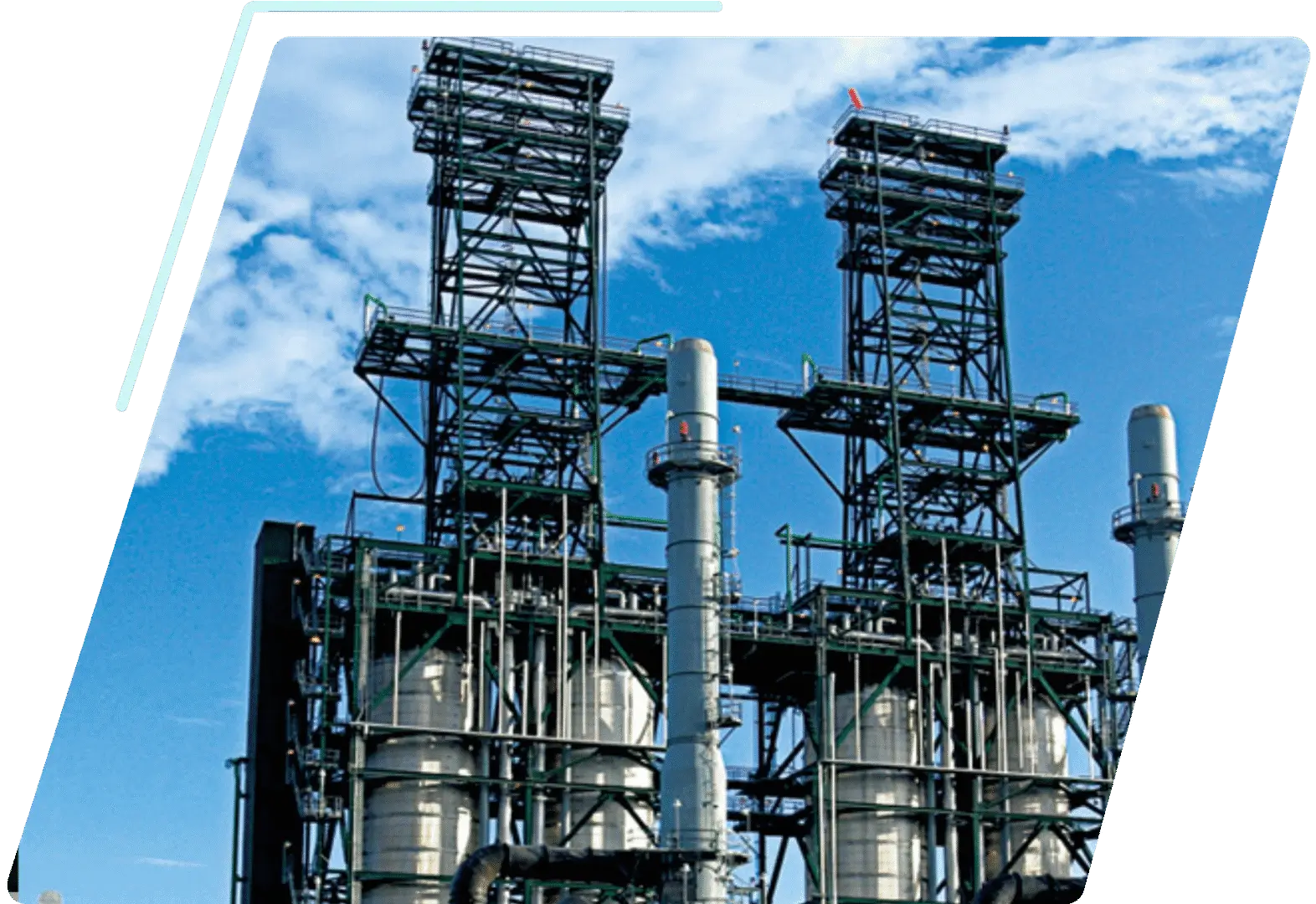 Industrial chemical plant towers against blue sky